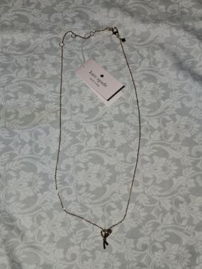 Kate Spade All Tied Up Gold Bow pendant necklace